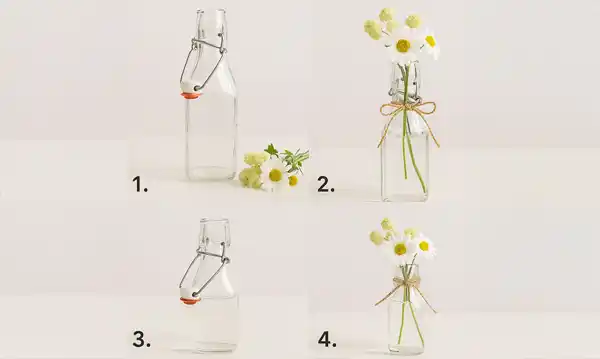 Vaso da fiori realizzato con una bottiglia con gancio in filo metallico