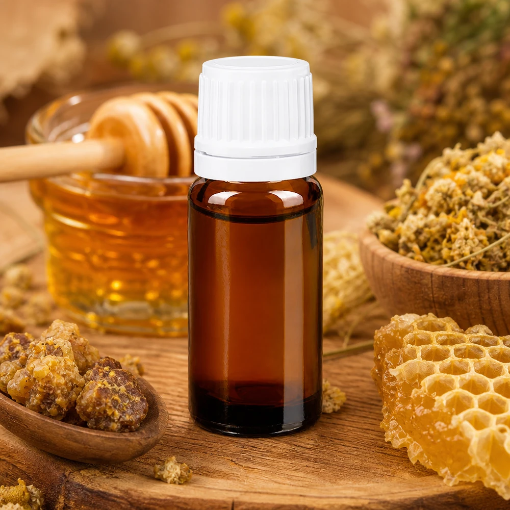 Flacone di vetro marrone da 10 ml con tappo contagocce bianco, decorato con un motivo a nido d'ape, miele ed erbe aromatiche