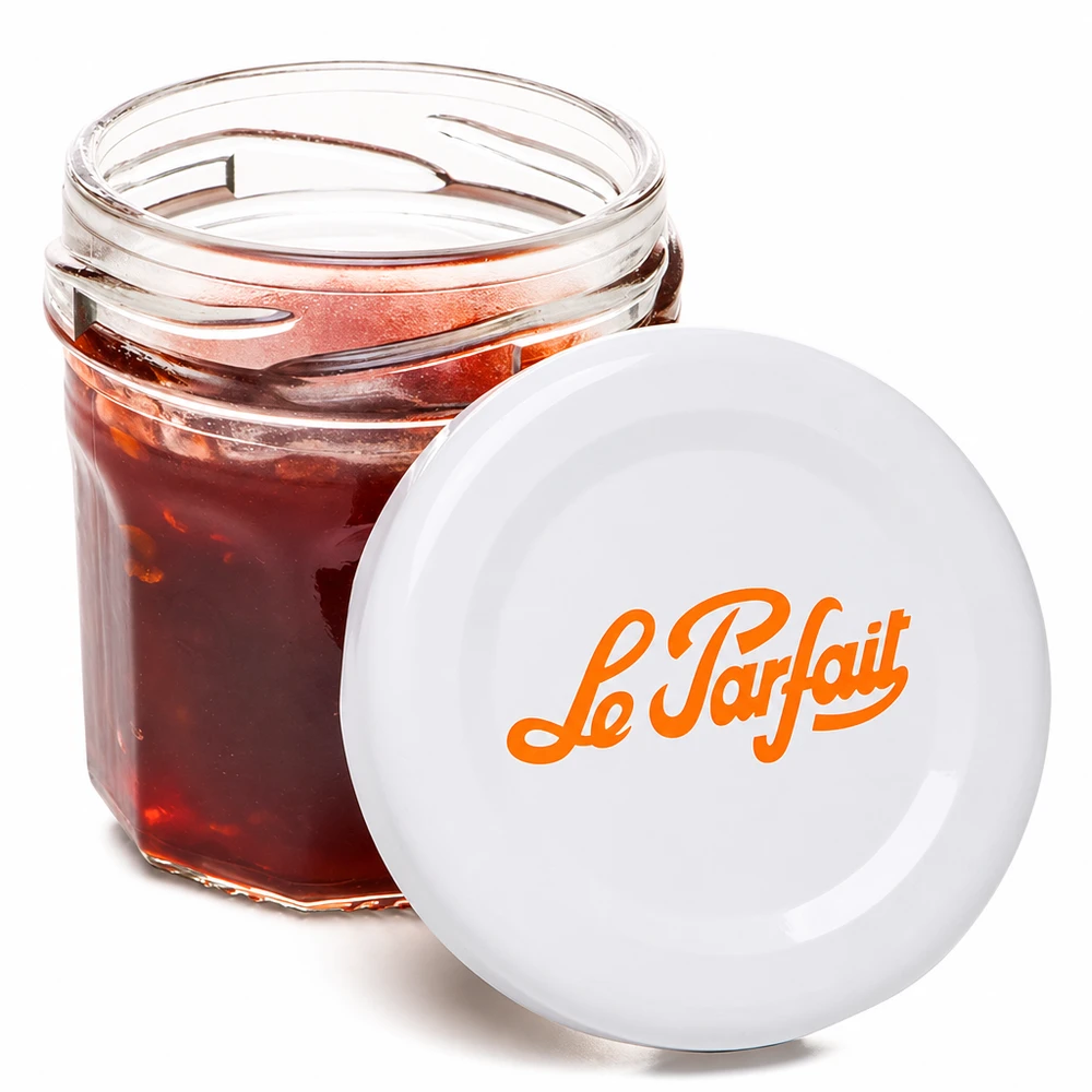 Mini vasetto Le Parfait da 44 ml aperto con marmellata rossa e logo arancione su coperchio bianco