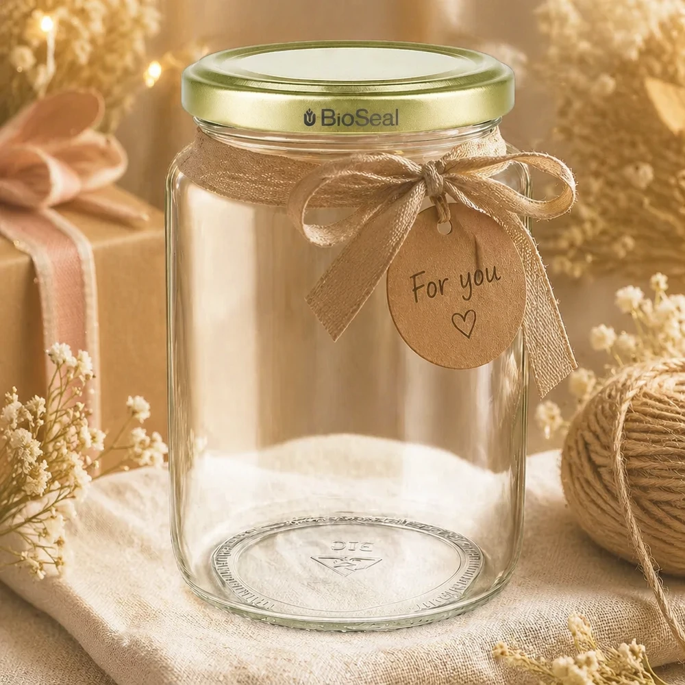 Vasetto per miele da 1000 g con capsula dorata BioSeal UNiTWIST Vasetto di miele BioSeal da 1000 g in regalo, decorato con un fiocco dorato e un ciondolo dal design rustico