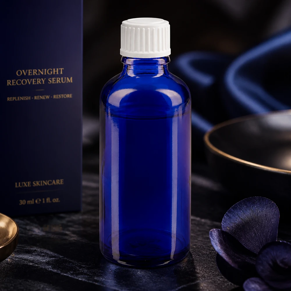 Flacone contagocce cilindrico da 50 ml in vetro ApoGlas, di colore blu cobalto, con tappo a vite bianco per sieri