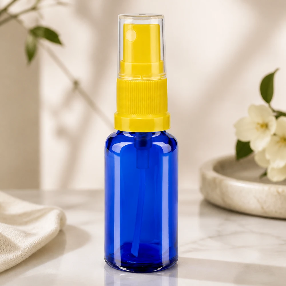 Flacone spray blu da 20ml STD giallo/trasparente in vetro da farmacia Flacone spray compatto da farmacia da 20 ml in vetro blu con erogatore giallo e tappo trasparente