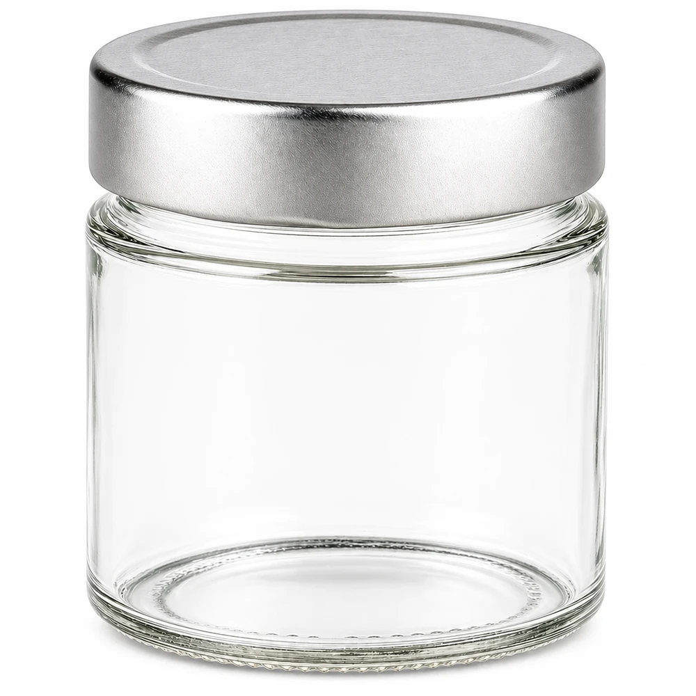 Barattolo rotondo da 135 ml + coperchio BasicSeal argento profondo UN.. Barattolo rotondo da 135 ml con coperchio BasicSeal argento vuoto su sfondo bianco Barattolo di vetro per la conservazione dei prodotti