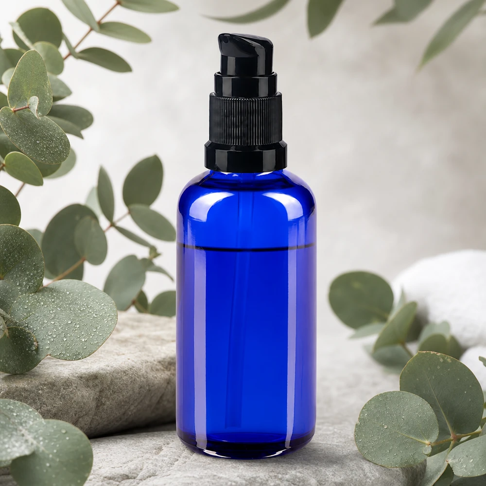 Flacone in vetro da 50 ml color blu cobalto con dosatore nero, ideale per sieri e oli
