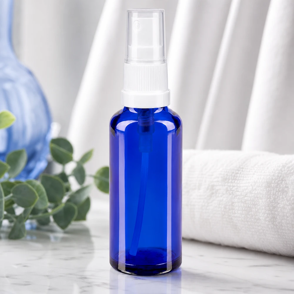 Flacone spray blu da 10 ml. STD nero/trasp. apoGlas Vaso spray blu cobalto in vetro da farmacia con tappo trasparente su base in marmo